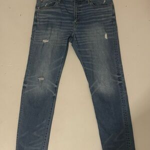 Distressed Blue Denim Jeans